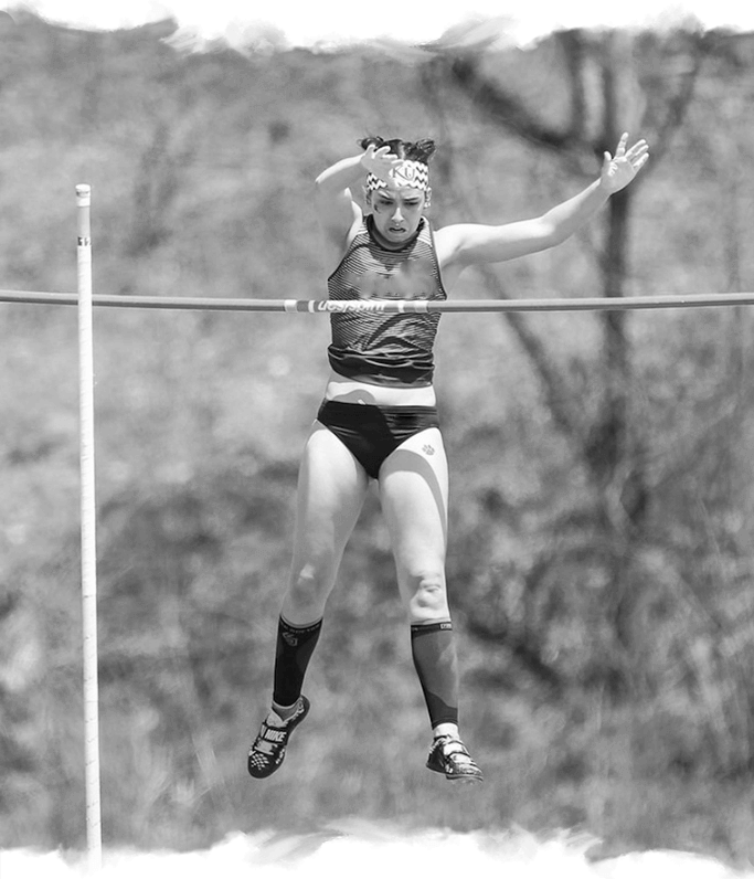 a woman is doing a high jump on a pole