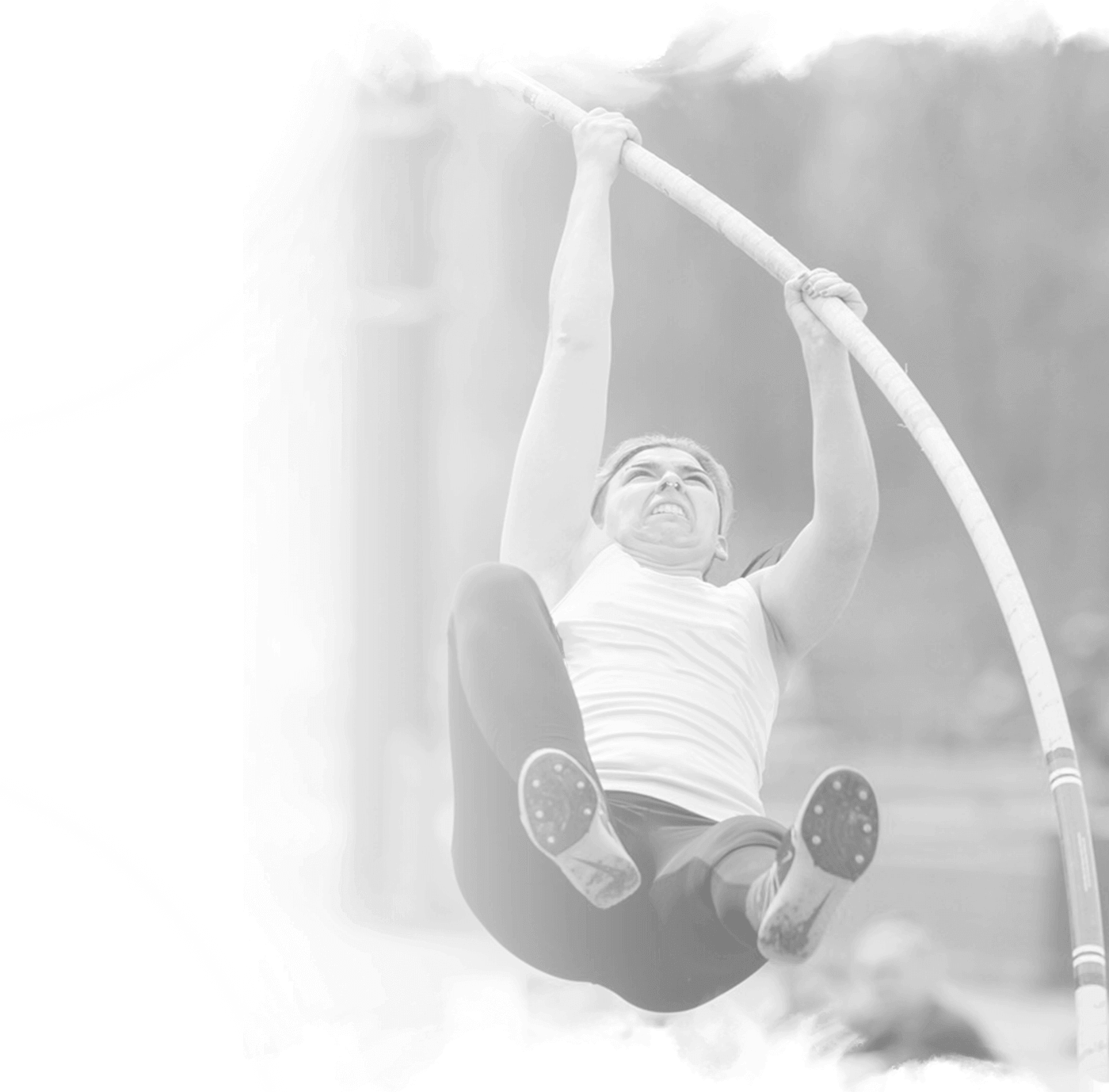 a woman is jumping in the air on a high jump